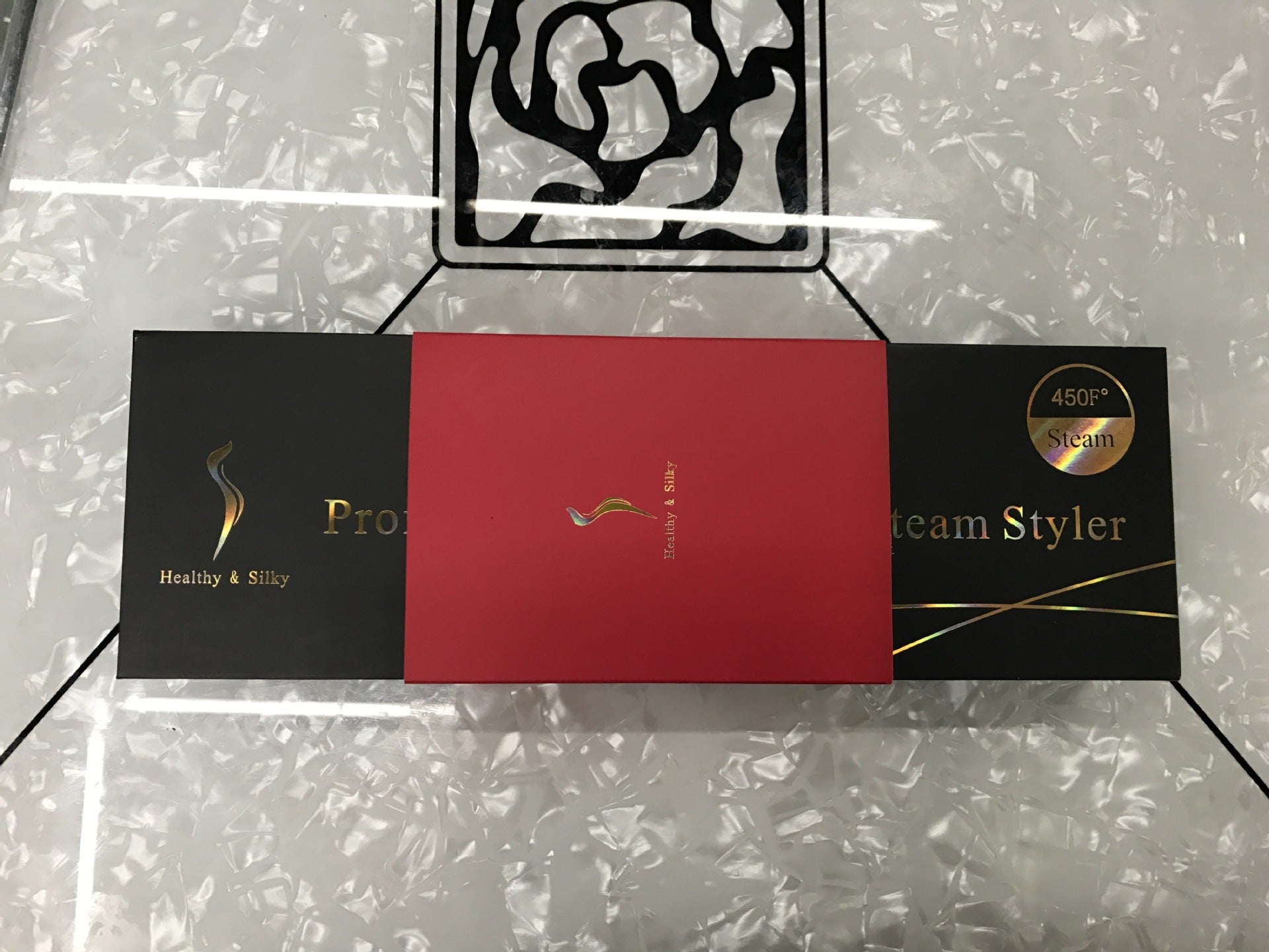 Lisseur à vapeur à pince