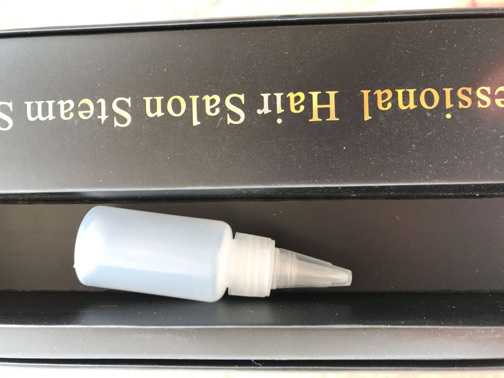 Lisseur à vapeur à pince