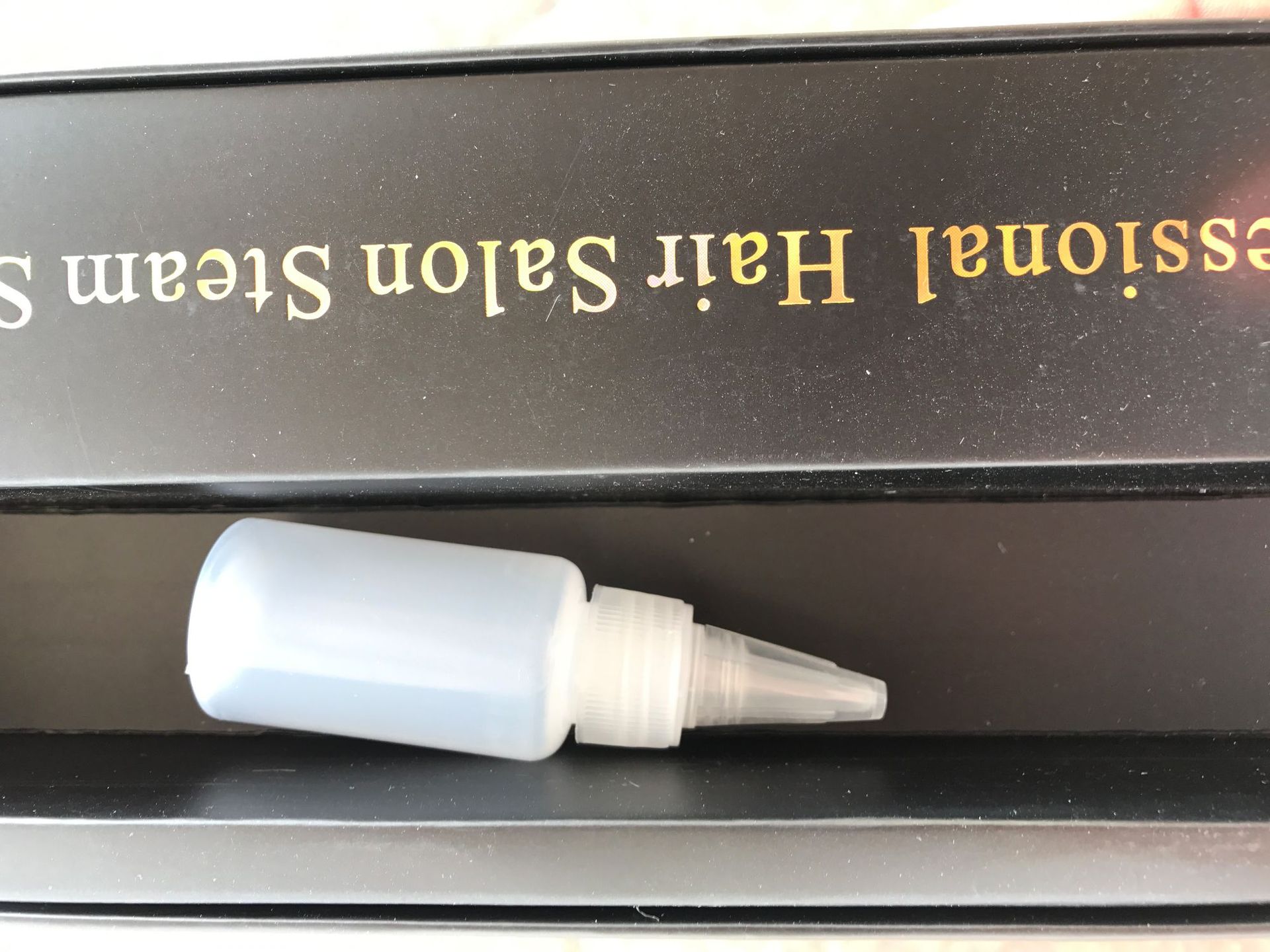 Lisseur à vapeur à pince